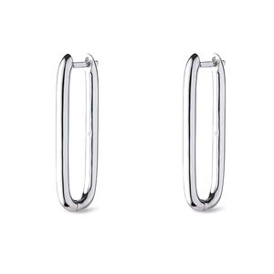 Macro view of polished silver U-shape hoop earrings with smooth metallic mirror finish