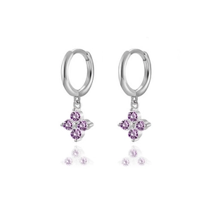Detailed macro of silver four-leaf clover earrings with purple zircon stones on white base
