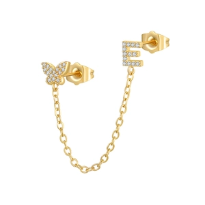 Detail of gold butterfly and letter E earrings with zircon pave on a delicate link chain