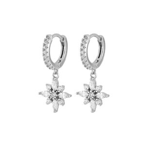 Elegant silver huggie earrings with sparkling zircon flower star charms on white background