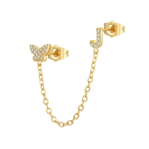 Detailed view of butterfly and letter J ear cuff connected by a fine gold chain
