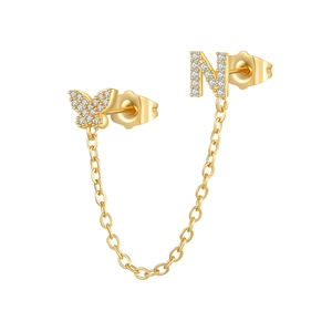 Detailed shot of gold plated chain earrings with zircon butterfly and letter N charm