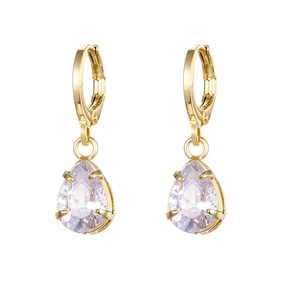 Close-up of golden hoop earrings with teardrop clear gemstone and four-claw setting