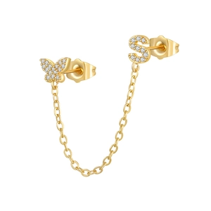 Detail of gold chain earring with zircon butterfly and letter S for multiple piercings