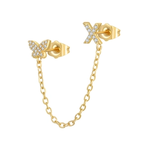 Detailed view of gold zircon butterfly and X letter earrings with connecting chain