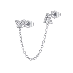 Close-up of butterfly and letter A earring set with zircon inlays and chain link