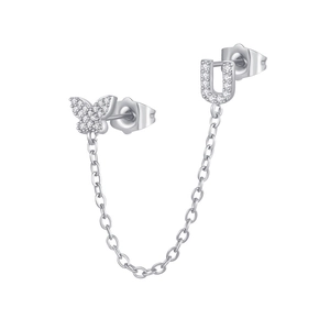 Detail of silver chain earring with zircon butterfly and letter U for double piercings