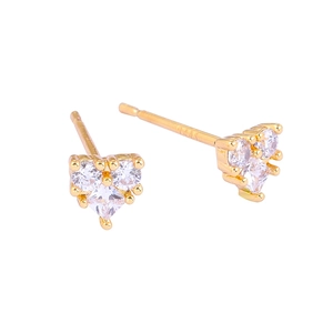 Macro shot of gold heart stud earrings featuring three precision-set zircon gemstones