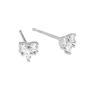 Detail view of heart-shaped earrings featuring three-stone zircons and 14K metal hallmark