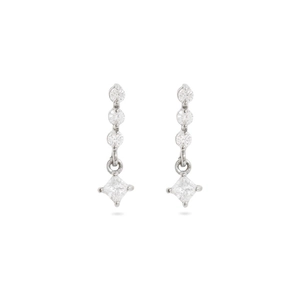 Close-up of silver earrings featuring princess cut cubic zirconia with a drop design