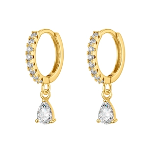 Macro shot of gold hoop earrings featuring teardrop zircon pendants and micro-paved gems