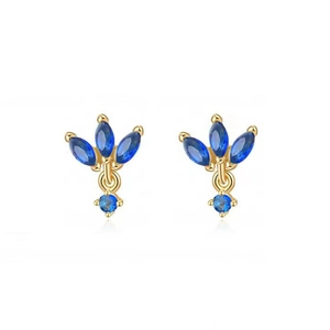 Boucles d'oreilles dorées avec pierres bleues foncées en marquise et détails en zircon