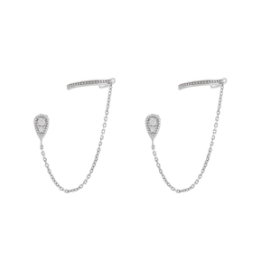 Detail of silver drop zircon stud earrings with chain connection to ear cuff