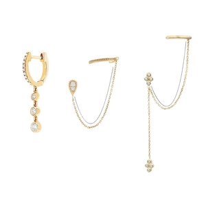 Set de tres elegantes pendientes dorados con circonitas brillantes y borlas en fondo blanco