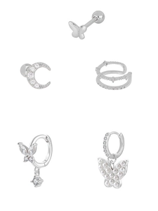 Macro view of silver butterfly earring set with moon studs and zircon crystal details