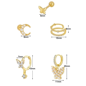 Five-piece gold butterfly earring set with zircon and pearl details on white background