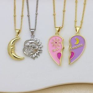 Detail of sun and moon pendants with magnetic heart shaped best friends charms