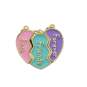 Detailed close-up of heart-shaped jigsaw pendant pieces engraved with Best Friends Forever