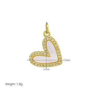 Detail view of heart pendant with shell inlay and cubic zirconia in 21mm by 15mm size
