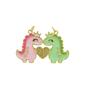 Detail of pink and green dinosaur pendants forming a sparkling rhinestone heart