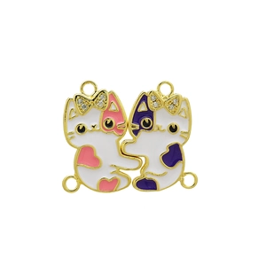 Detail of pink and purple cat pendants with magnet heart and golden bow for DIY jewelry