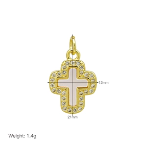 Detail of 21mm gold cross pendant with white shell inlay and zircon border weighing 1.4g