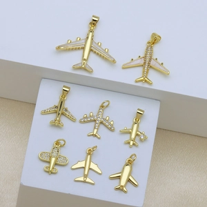 Set of eight 18K gold plated airplane pendants with zircon and white enamel details