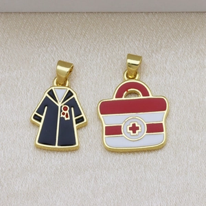 Colorful medical doctor coat and first aid kit charms in gold plating with enamel detail