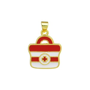 Close-up of a gold medical kit charm with red cross enamel detail and secure loop