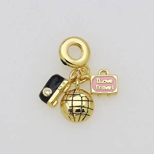Detail of travel charms with camera, globe, and pink luggage engraved with I love Travel