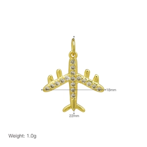 Macro detail of 18K gold plated airplane pendant with cubic zirconia and dimensions