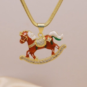 Elegant gold rocking horse pendant necklace with brown enamel and sparkling zircons
