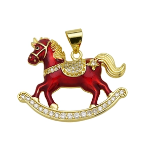 Detailed view of rocking horse pendant with red enamel and gold-plated cubic zirconia