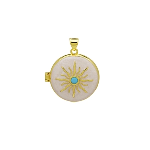 Detail of golden locket pendant with white enamel sunburst pattern and blue stone