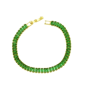 Detail of 18K gold-plated tennis bracelet featuring rectangular green zircon stones and clasp