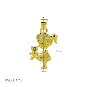 Detail of 18K gold girl and bear pendant with cubic zirconia, size 26x13mm, 1.7g