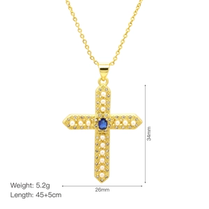 Goldene Kreuzhalskette mit weißen Perlen, Zirkonia und einem blauen ovalen Stein