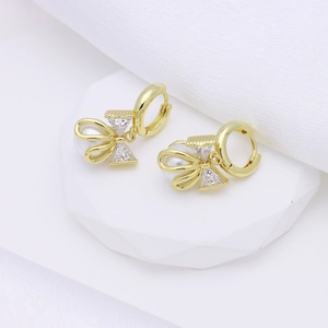 Elegant gold-plated bow huggie earrings with triangle zircon and white pearl accents