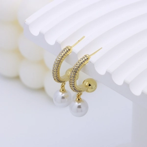 Golden C-shaped pearl drop earrings with cubic zirconia pavé and white pearl charms