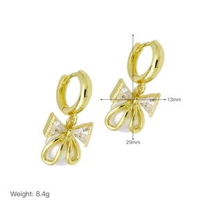 Detailed view of pearl bow earrings showing 13mm width and 29mm height dimensions
