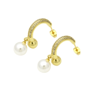 Detailed view of gold C-shaped earrings with micro-pave zircons and dangling white pearls