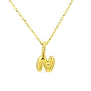 Macro shot of 3D puffy gold-plated letter N pendant with sparkling zircon bail
