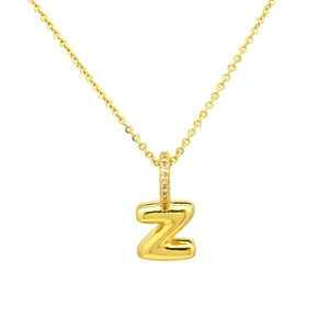 Detail shot of golden balloon 3D letter Z pendant with sparkling pavé cubic zirconia