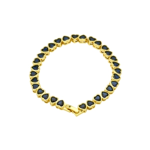 Detailed close-up of gold bracelet featuring heart-shaped blue zircon stone inlay work