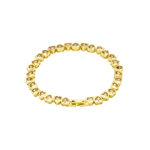 Detailed close-up of golden heart chain bracelet with champagne zircon inlay