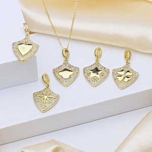 Gold plated copper necklace with zircon encrusted shield pendants featuring heart and star motifs