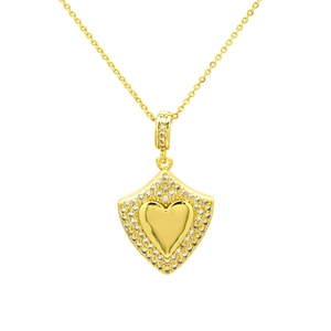 Close-up of gold shield heart pendant necklace with shimmering zircon stones