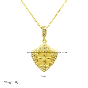 Gold shield necklace with lucky clover pendant and micro-paved zircons for women