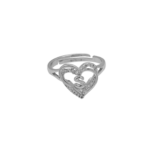 Detailed shot of open silver ring with zircon heart frame and metal letter S feature