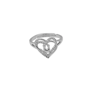 Detail of silver heart ring with pavé cubic zirconia and inner U-shaped horseshoe motif